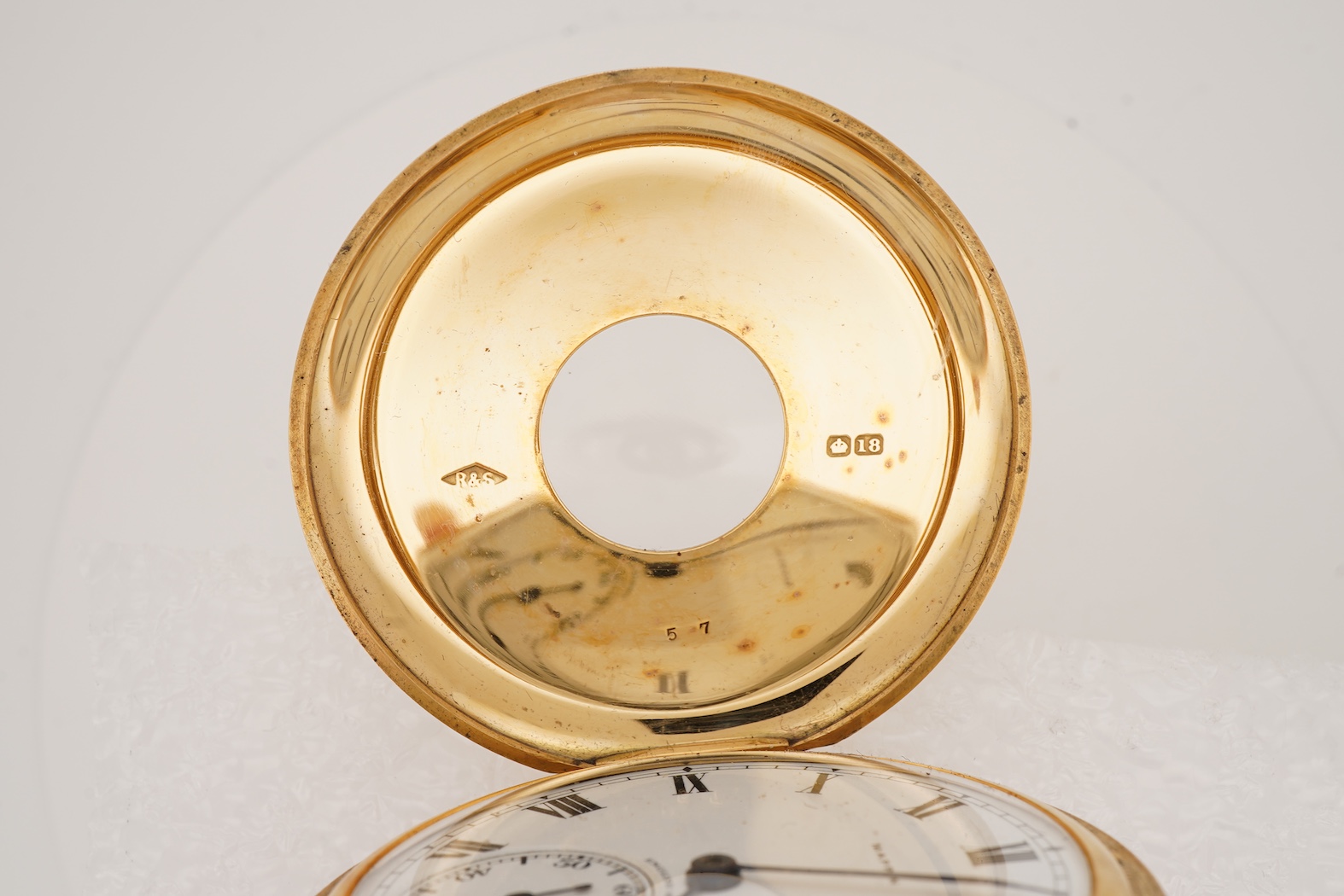 A George V 18ct gold half hunter keyless lever pocket watch, retailed by Mappin